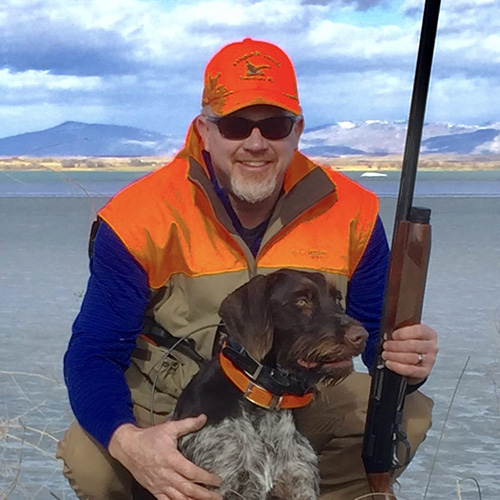 Daryl Lutz with his hunting dog
